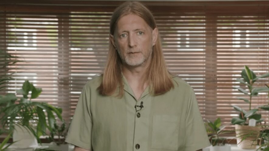 Jason Rhodes, co-founder of Rhodon Films, speaks earnestly to the camera about enhancing nonprofit organisations' web presence using proficient video content.