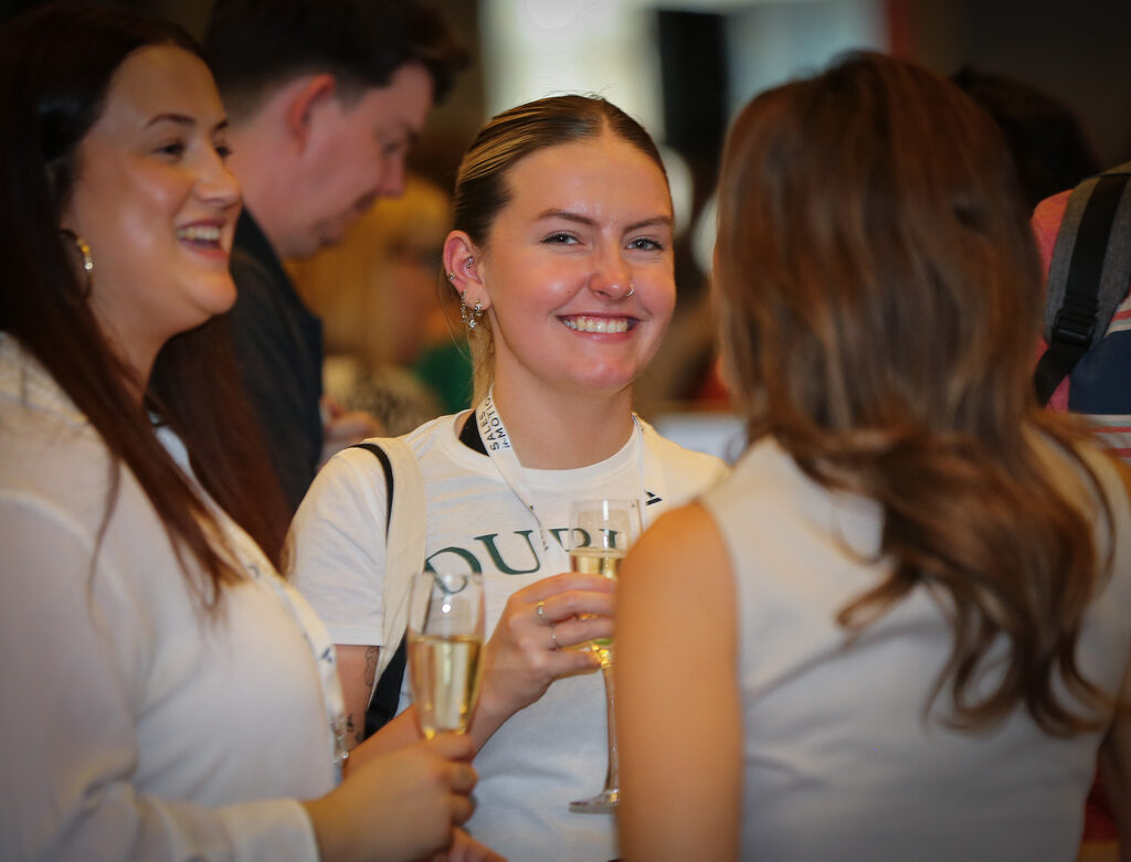 Attendees at an event enjoying each other's company